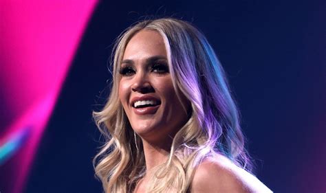 sexy photos of carrie underwood|Carrie Underwood Puts Toned Abs on Display in Flirty Pink Bikini